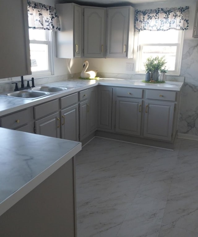 kitchen with gray cabinets and sink