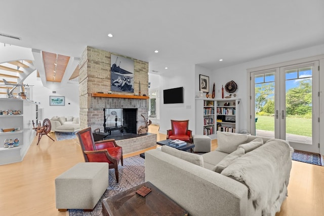 5457 Bayford Rd, Eastville, VA 23354 - living room featuring wood finished floors, a fireplace, and recessed lighting