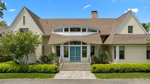 5457 Bayford Rd, Eastville, VA 23354 - rear view of property featuring a shingled roof, a chimney, and entry steps