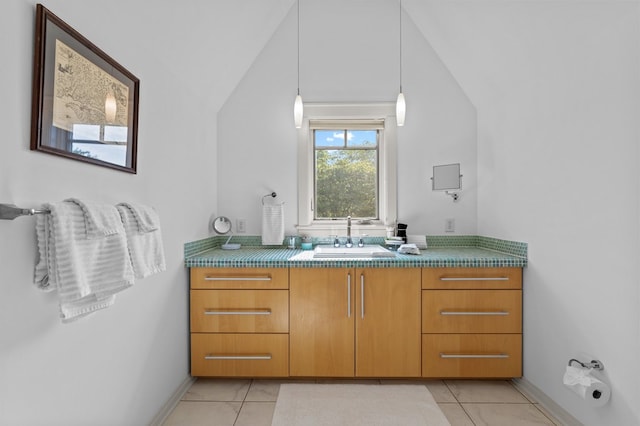5457 Bayford Rd, Eastville, VA 23354 - bathroom with tile patterned flooring, vaulted ceiling, baseboards, and vanity