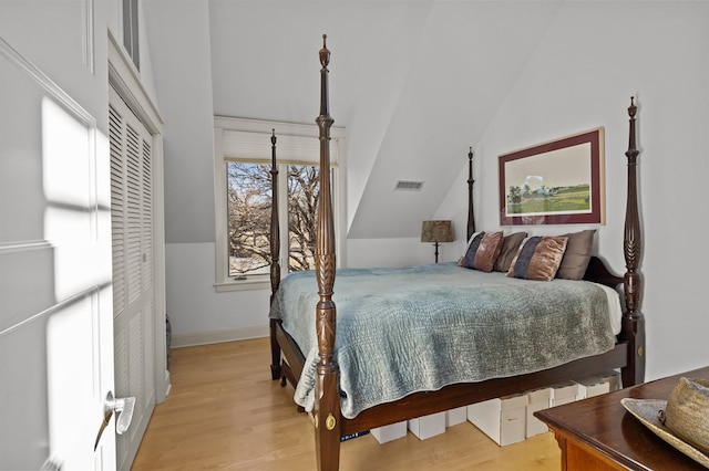 5457 Bayford Rd, Eastville, VA 23354 - bedroom featuring lofted ceiling, light wood finished floors, and baseboards