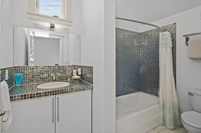 5457 Bayford Rd, Eastville, VA 23354 - bathroom with toilet, shower / tub combo, vanity, tile patterned flooring, and decorative backsplash