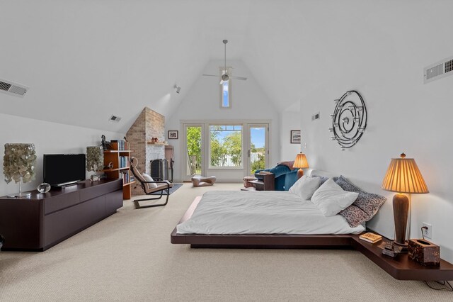 5457 Bayford Rd, Eastville, VA 23354 - carpeted bedroom featuring high vaulted ceiling, ceiling fan, and a large fireplace