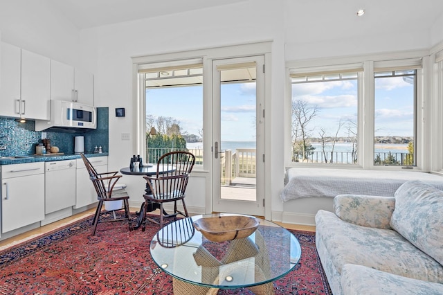 5457 Bayford Rd, Eastville, VA 23354 - living area with light wood-style floors and a water view