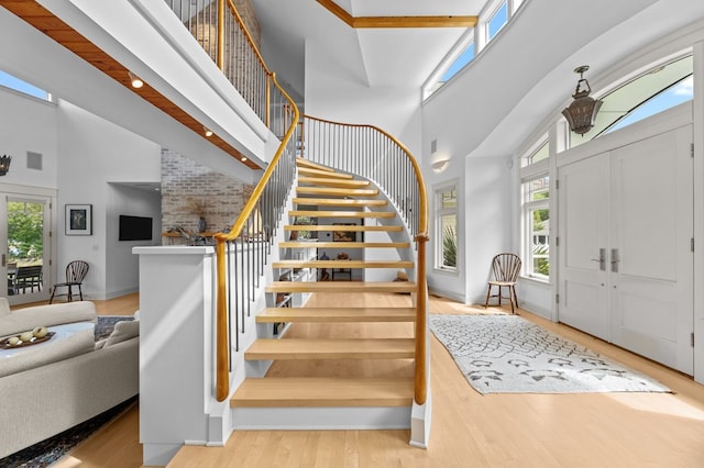 5457 Bayford Rd, Eastville, VA 23354 - entryway featuring a high ceiling, plenty of natural light, stairway, and wood finished floors