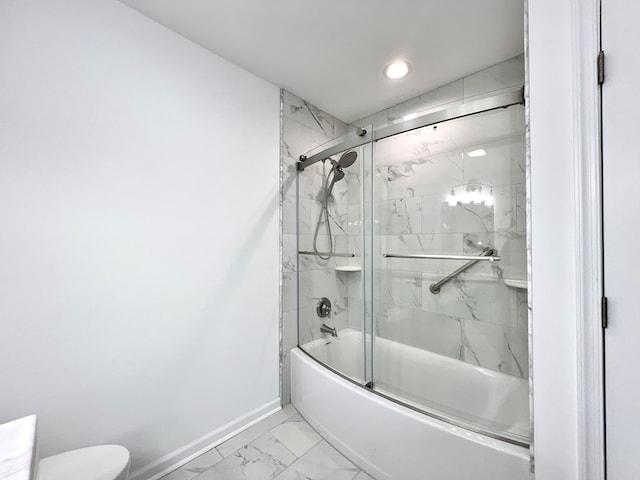 bathroom with enclosed tub / shower combo and toilet