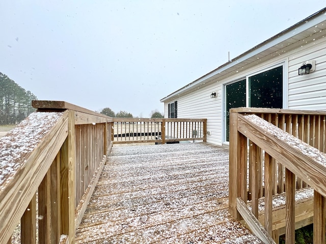 view of snow covered deck