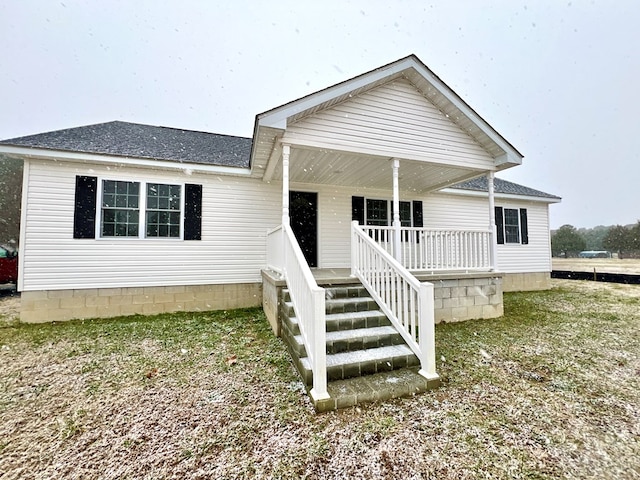 view of front of property featuring covered porch