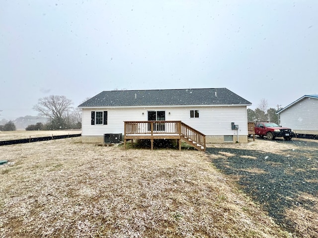 back of house featuring central air condition unit and a deck