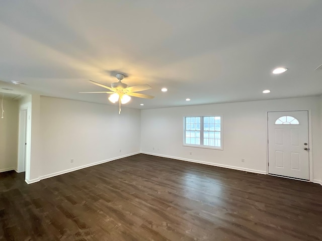 interior space featuring ceiling fan and dark hardwood / wood-style flooring