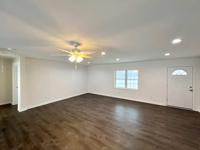 interior space with dark hardwood / wood-style flooring and ceiling fan