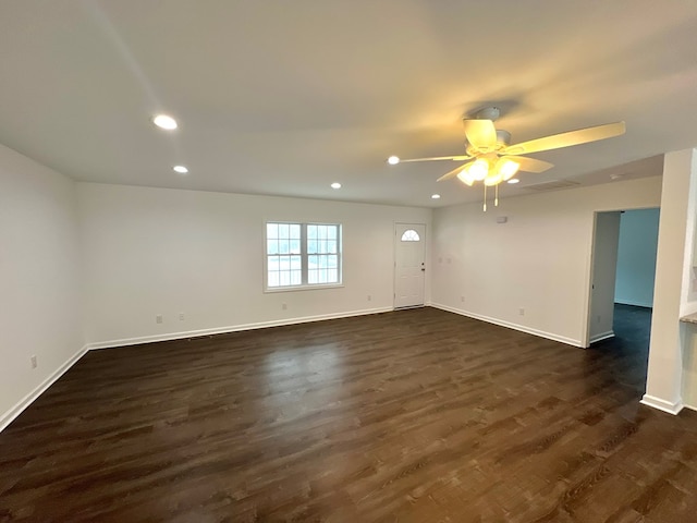 unfurnished room featuring dark hardwood / wood-style floors and ceiling fan