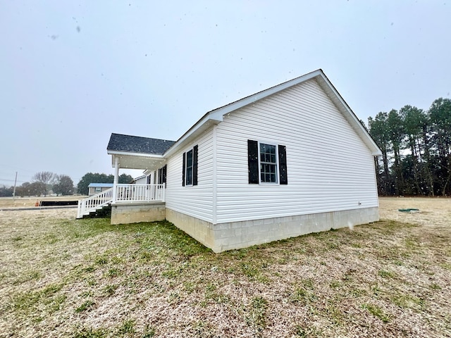 view of property exterior featuring a yard