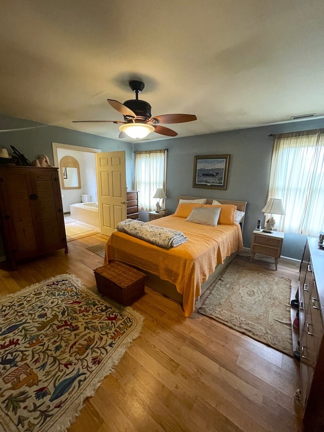 bedroom featuring light hardwood / wood-style flooring and ceiling fan