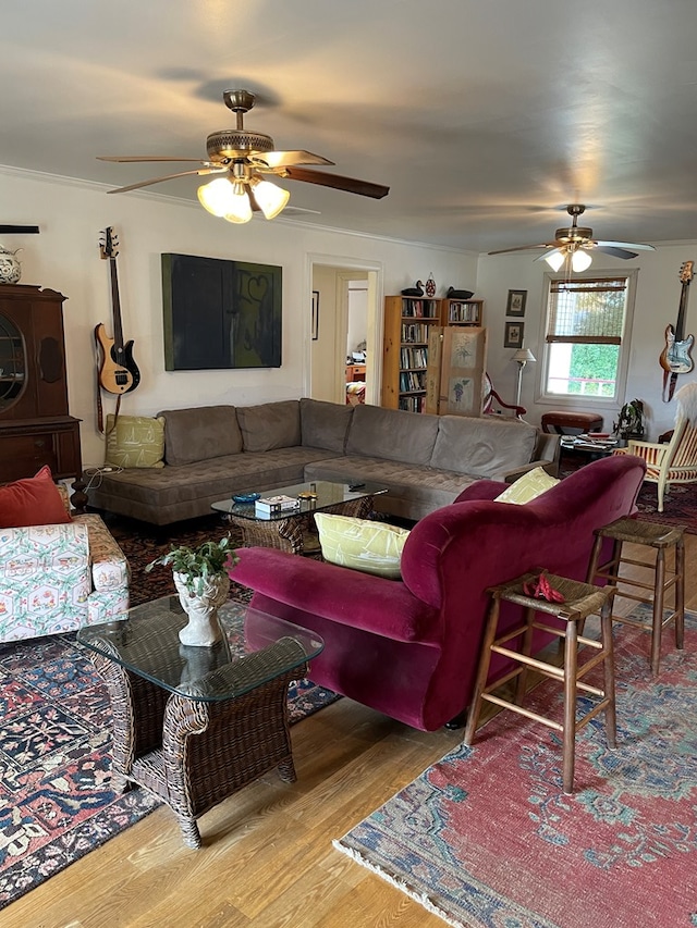 living room featuring ceiling fan and light hardwood / wood-style floors