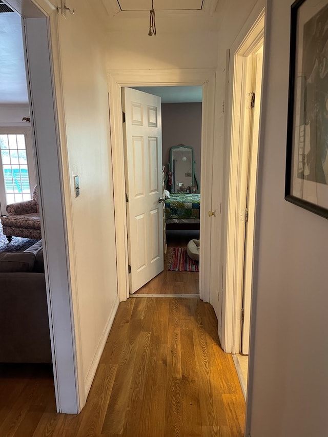 hall with light hardwood / wood-style floors