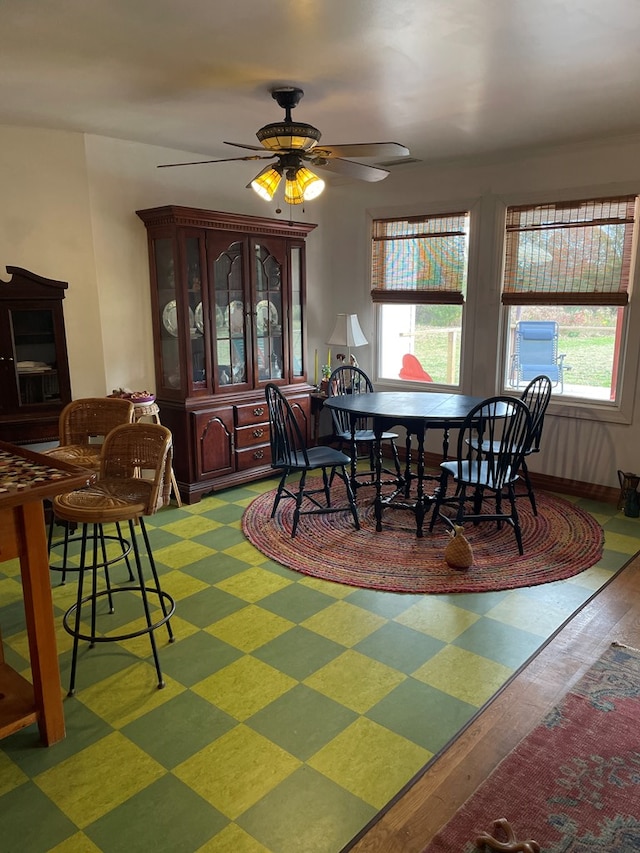 dining space with ceiling fan