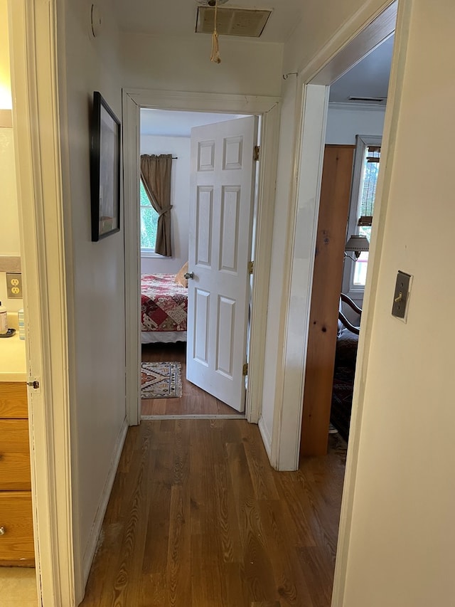 hall with dark hardwood / wood-style floors