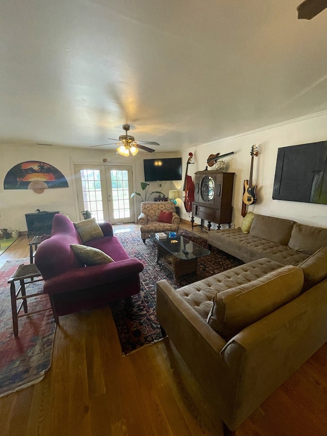 living room featuring hardwood / wood-style flooring and ceiling fan