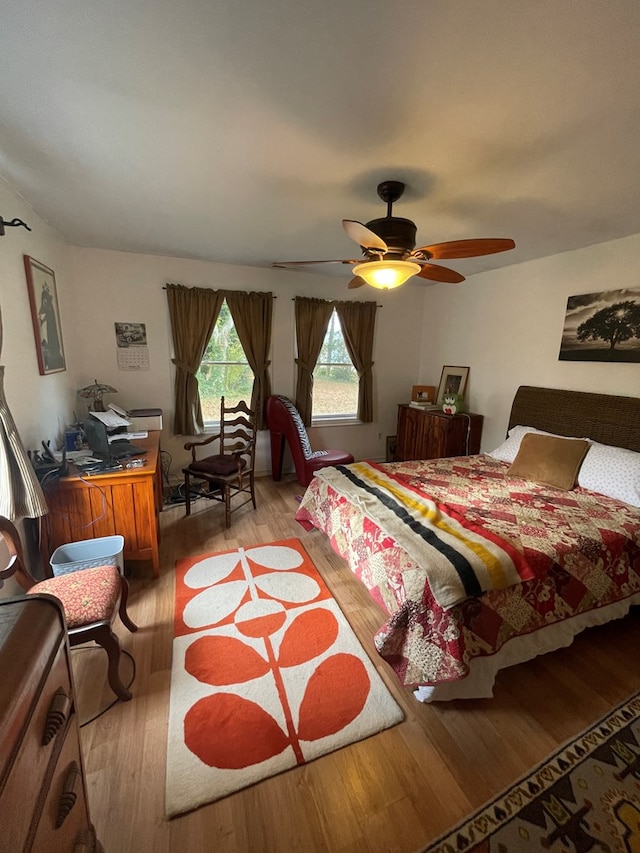 bedroom featuring ceiling fan and light hardwood / wood-style floors