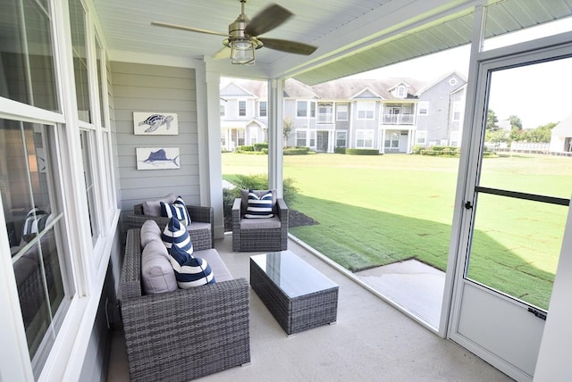 sunroom / solarium with ceiling fan