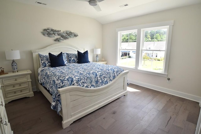 bedroom featuring ceiling fan, dark wood-type flooring, and vaulted ceiling