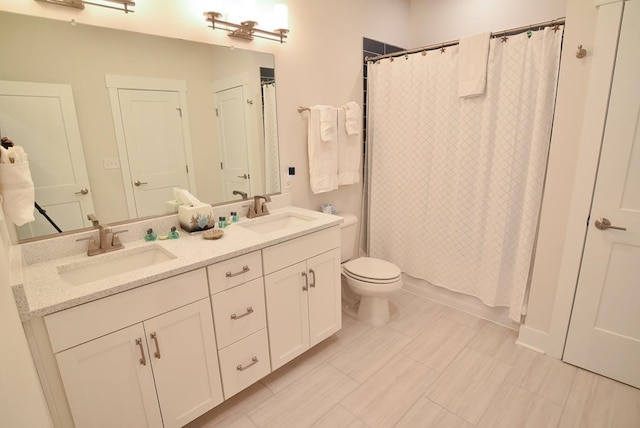 full bathroom with shower / tub combo, vanity, and toilet