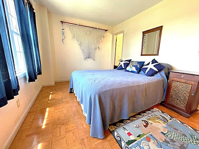 bedroom featuring light parquet floors