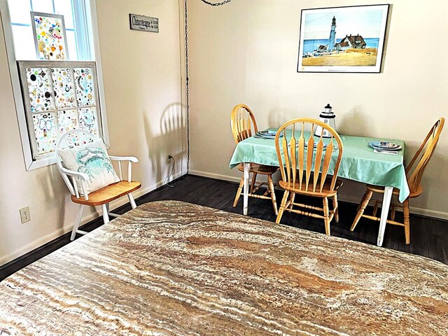 dining area featuring dark hardwood / wood-style flooring