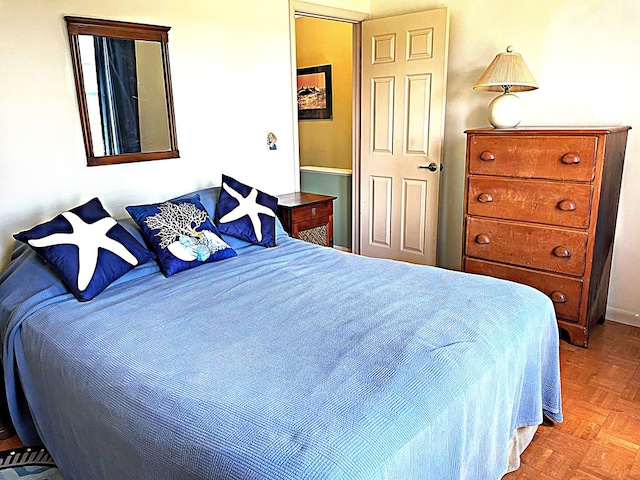 bedroom featuring light parquet floors