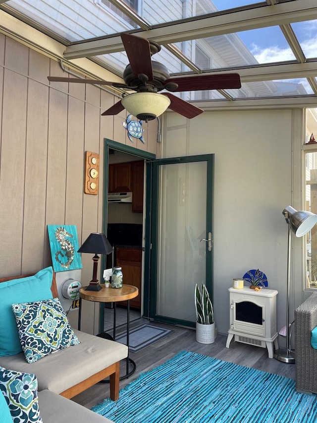 sunroom / solarium with ceiling fan