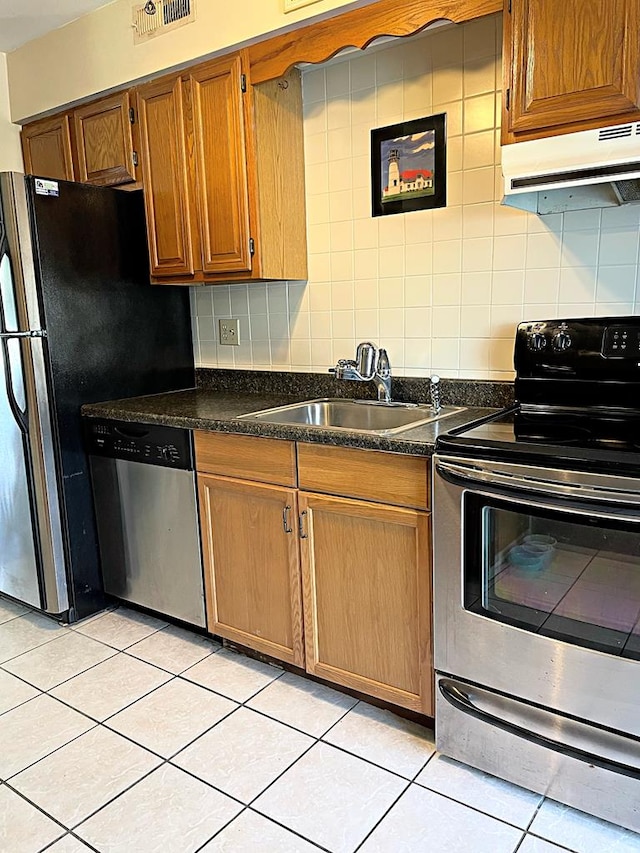 kitchen with exhaust hood, sink, decorative backsplash, light tile patterned floors, and stainless steel appliances