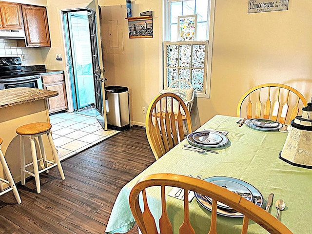 dining space with light hardwood / wood-style floors