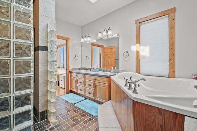 5095 Blake Point Rd, Chincoteague, VA 23336 - bathroom featuring double vanity, a garden tub, a walk in shower, and a chandelier