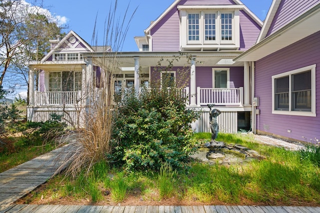 5095 Blake Point Rd, Chincoteague, VA 23336 - victorian home with covered porch