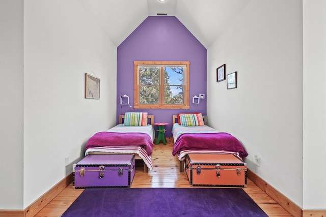 5095 Blake Point Rd, Chincoteague, VA 23336 - bedroom with hardwood / wood-style floors and vaulted ceiling