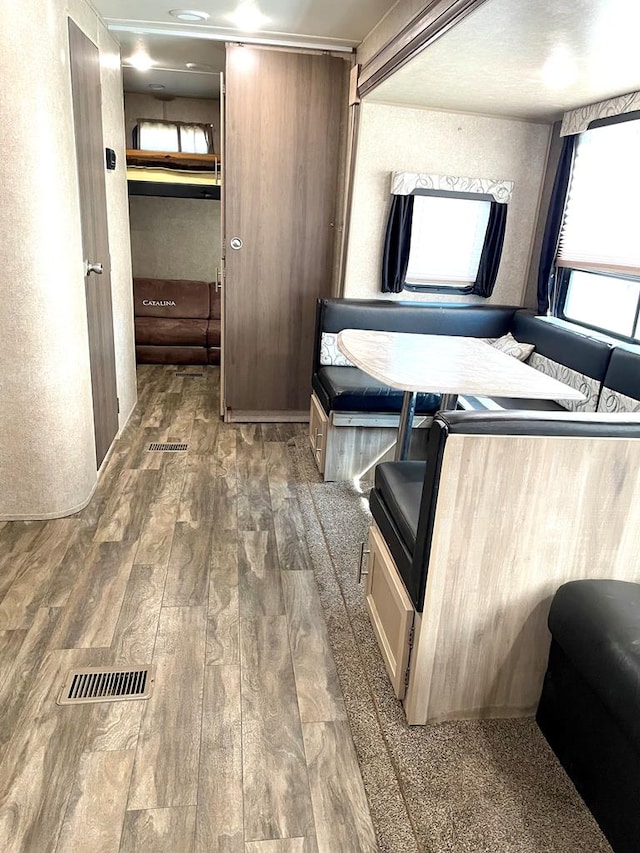 bathroom with visible vents and wood finished floors