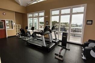 exercise room with lofted ceiling