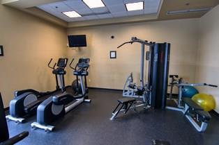 exercise room with a paneled ceiling