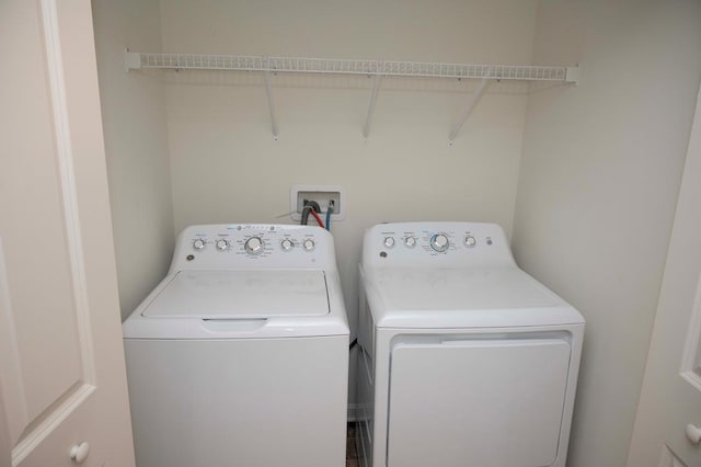 washroom with independent washer and dryer