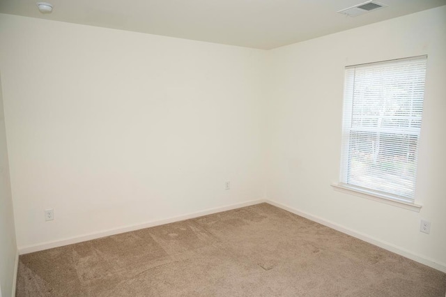 empty room with light colored carpet