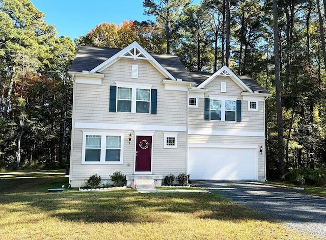 view of front of house featuring a garage and a front yard