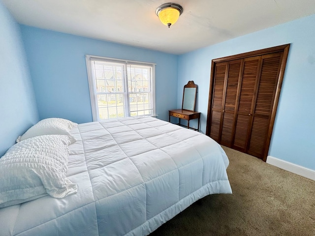 6136 Maddox Blvd, Chincoteague, VA 23336 - carpeted bedroom with a closet and baseboards
