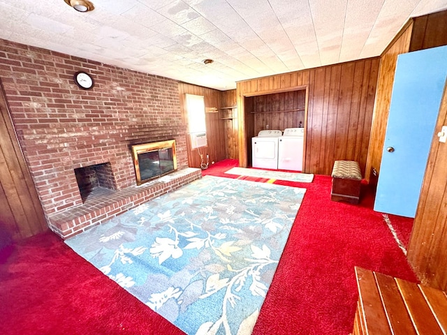 6136 Maddox Blvd, Chincoteague, VA 23336 - living area with wood walls, a brick fireplace, independent washer and dryer, and carpet floors