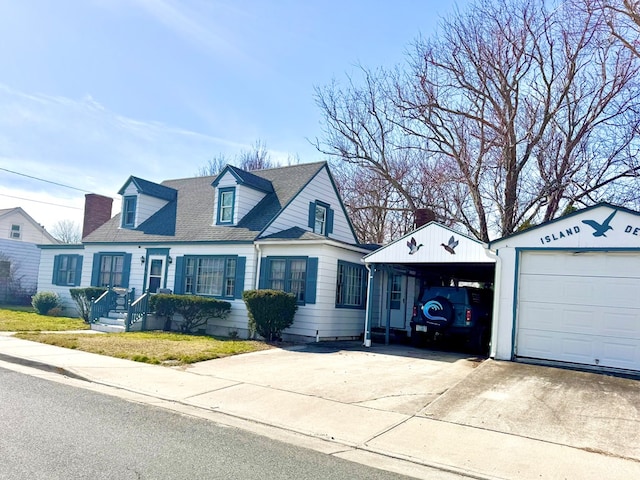 6136 Maddox Blvd, Chincoteague, VA 23336 - new england style home with a garage and roof with shingles