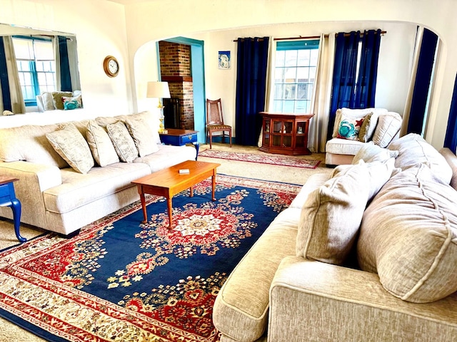 6136 Maddox Blvd, Chincoteague, VA 23336 - living area featuring arched walkways and a brick fireplace