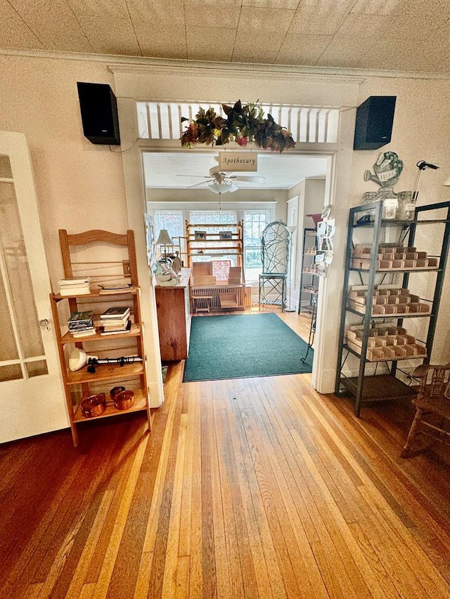 interior space featuring hardwood / wood-style floors and ornamental molding