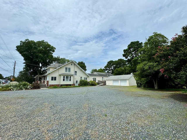 view of front of house with an outbuilding and a garage