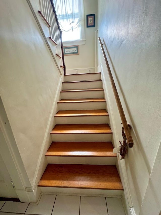 stairs with tile patterned floors