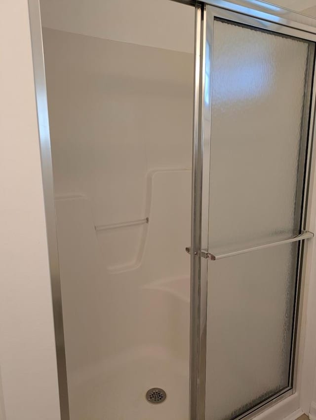 bathroom with an enclosed shower